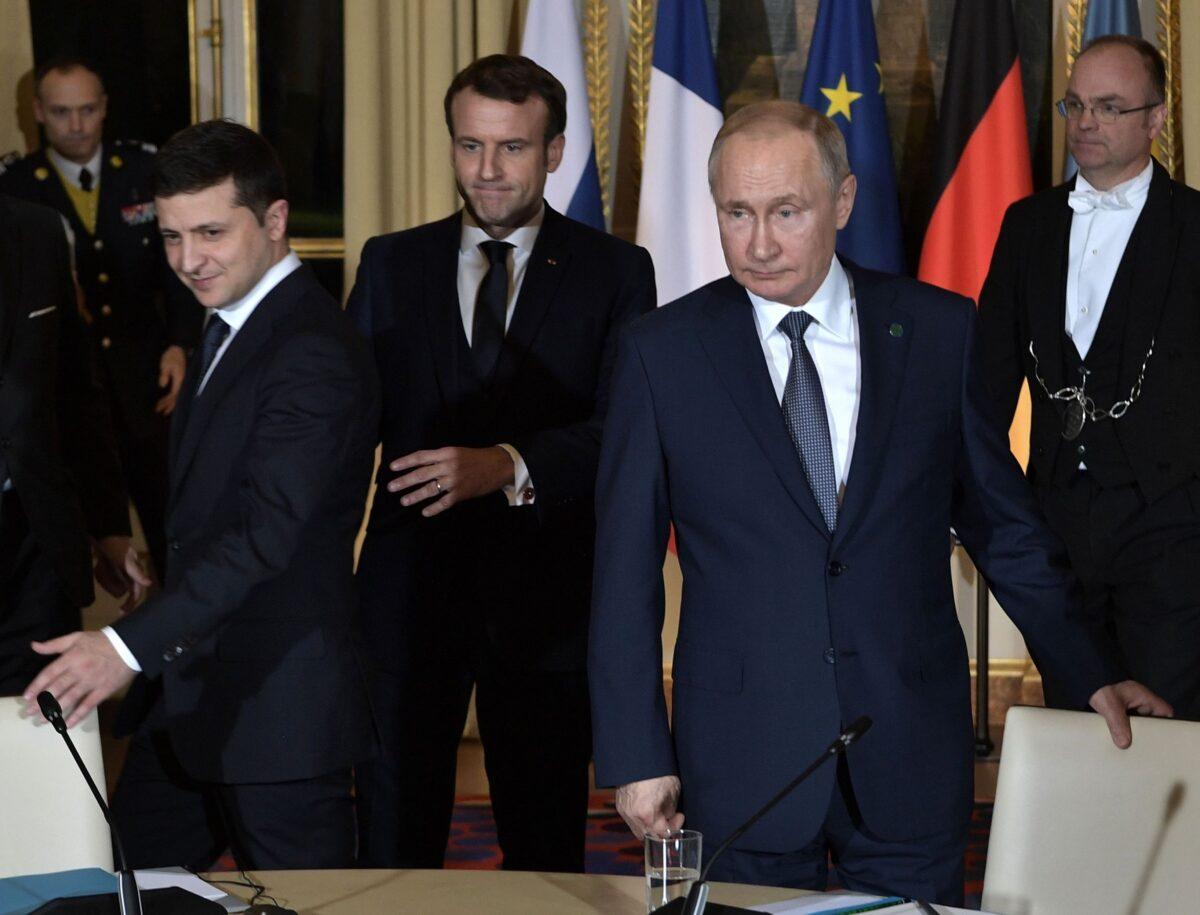(L–R) Ukrainian President Volodymyr Zelensky, French President Emmanuel Macron, and Russian President Vladimir Putin arrive for a meeting on Ukraine with German Chancellor at the Elysee Palace, in Paris, on Dec. 9, 2019. (Alexey Nikolsky/Sputnik/AFP via Getty Images)