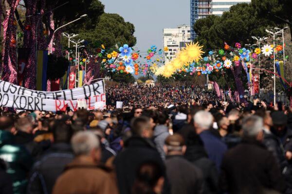 Protesters gather during a rally in Tirana, Albania, on March 12, 2022. (Franc Zhurda/AP Photo)