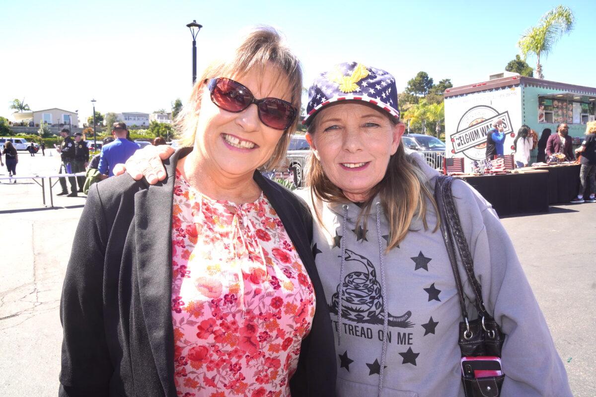 Susan Meyer (R) and Darlene McCint of California said they are both hoping for a GOP sweep in the 2022 midterm elections. Below, Jeanne and Michael McKinney are hopeful that Americans will wake up to what they believe are self-destructive policies of the left. (Allan Stein/The Epoch Times)
