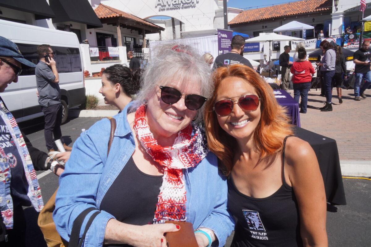 Gail Kimura (R) and Stevie Strang said they are optimistic of a national revival with conservative leadership. Both were among the crowd of 3,000 that attended Clay Clark's "Reawaken America" tour stop in San Diego, on March 11. (Allan Stein/The Epoch Times)