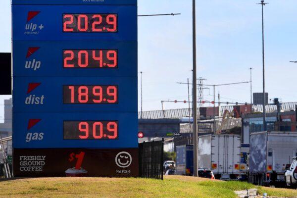 A sign outside a petrol station shows the price of petrol breaking through the two Australian dollar (1.46 USD) a litre mark in Melbourne, Victoria, on March 3, 2022. (William West/AFP via Getty Images)
