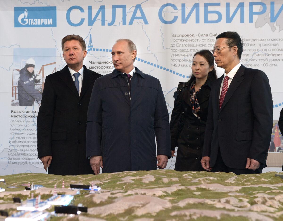 Russia's gas giant Gazprom CEO, Alexei Miller (L), Russian President Vladimir Putin (2nd L), and Chinese Vice Premier Zhang Gaoli (R) attend the ceremony marking the welding of the first link of "The Power of Siberia" main gas pipeline, near the village of Us Khatyn, outside Yakutsk, on Sept. 1, 2014. (Alexey Nikolsky/Ria Novosti/AFP via Getty Images)
