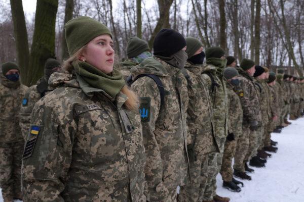 Civilians, including Tatiana (L), 21, a university veterinary medicine student who's also enrolled in a military reserve program, participate in a Kyiv Territorial Defense unit training in Kyiv, Ukraine, on Jan. 22, 2022. (Sean Gallup/Getty Images)