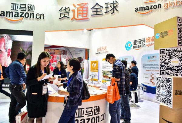 Visitors gathering at Amazon booth during the 2016 China International Electronic Commerce Expo in Yiwu, Zhejiang Province, China, on April 11, 2016. (STR/AFP via Getty Images)