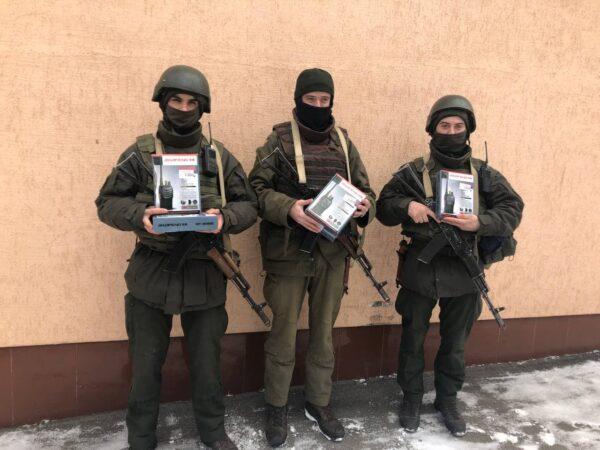 A group of Ukrainian militia pose with new radios. (Photo courtesy of Todd Gallagher)