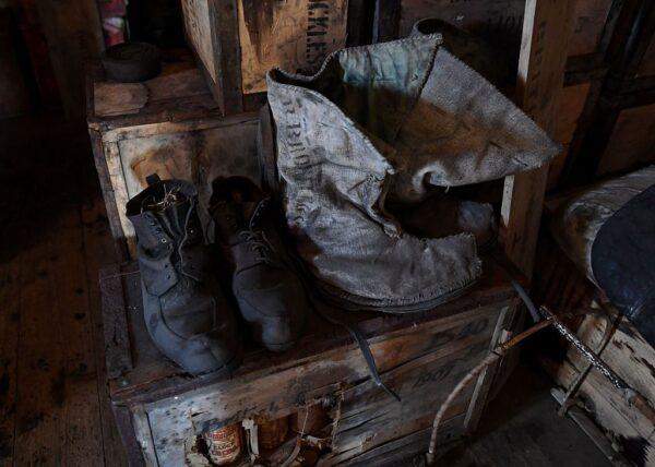 Old boots left inside the historic Shackleton hut, which was used by polar explorer Ernest Shackleton and his team during the golden age of exploration at the turn of the last century, were seen near McMurdo Station Antarctica, on Nov. 11, 2016. (Mark Ralston/AFP via Getty Images)