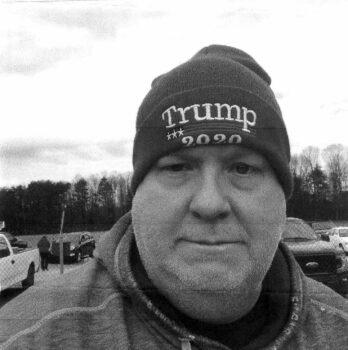 James Leslie Little, 51, of Claremont, North Carolina, showing off the cap he wore to the Ellipse and the Capitol on Jan. 6, 2021. (U.S. Department of Justice/Screenshot via The Epoch Times)