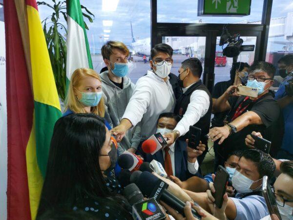 General Director of Immigration, Katherine Calderon addresses reporters during a press conference while standing beside Ukrainian refugees Mykhailo and Oksana Karpenko in Santa Cruz, Bolivia on March 13. (Autumn Spredemann/The Epoch Times)