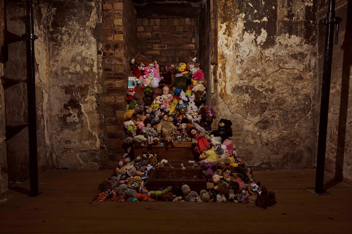 Visitors to the Real Mary Kings Close in Edinburgh, Scotland, leave toys to honor a child who lost her family to the bubonic plague. (Photo courtesy of the Real Mary King's Close)