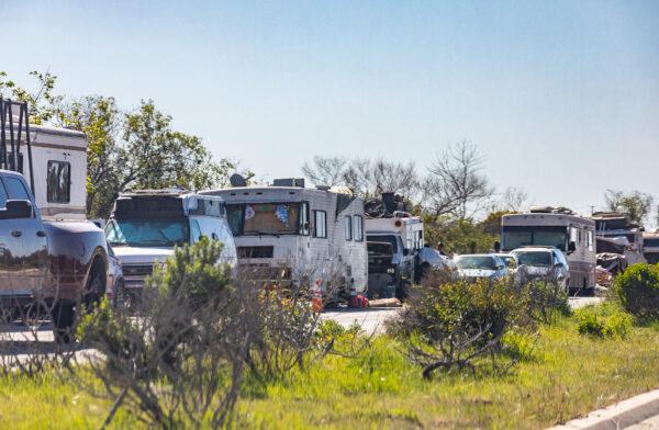 A homeless encampment of vehicles lines Jefferson along Ballona Creek in Playa Del Rey, Calif., on Feb. 18, 2022. (John Fredricks/The Epoch Times)