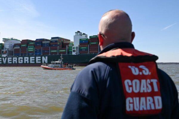 A response boat crew from Coast Guard Station Curtis Bay monitors the 1,095-foot motor vessel Ever Forward, which became grounded in the Chesapeake Bay on March 13, 2022. (U.S. Coast Guard photo by Petty Officer 3rd Class Kimberly Reaves/Released)