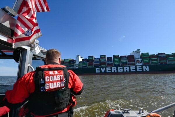 A response boat crew from Coast Guard Station Curtis Bay monitors the 1,095-foot motor vessel Ever Forward, which became grounded in the Chesapeake Bay, on March 13, 2022. (U.S. Coast Guard photo by Petty Officer 3rd Class Kimberly Reaves/Released)