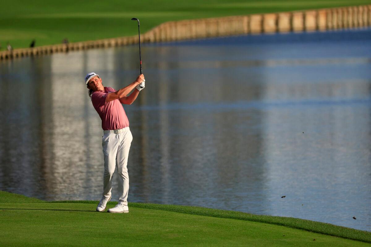 Cameron Smith of Australia plays an approach shot on the 18th fairway during the final round of THE PLAYERS Championship on the Stadium Course at TPC Sawgrass in Ponte Vedra Beach, Flor., on March 14, 2022. (Mike Ehrmann/Getty Images)