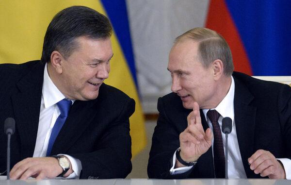 Russia's President Vladimir Putin (R) talks with Ukrainian President Viktor Yanukovych during a signing ceremony at the Kremlin in Moscow, Russia, on Dec. 17, 2013. (Alexander Nemenov/AFP via Getty Images)