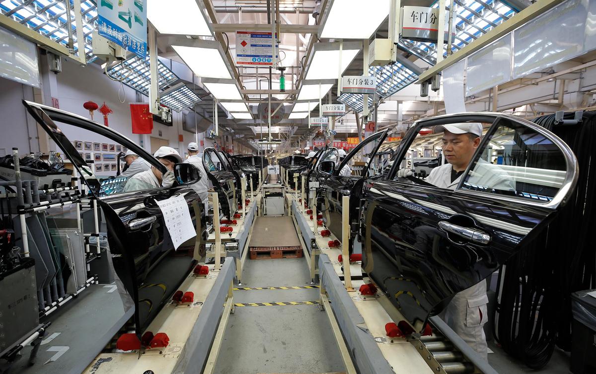 Chinese employees work on a production line of automobiles at a factory in Changchun in China's Jilin Province, on Nov. 1, 2017. (STR/AFP via Getty Images)