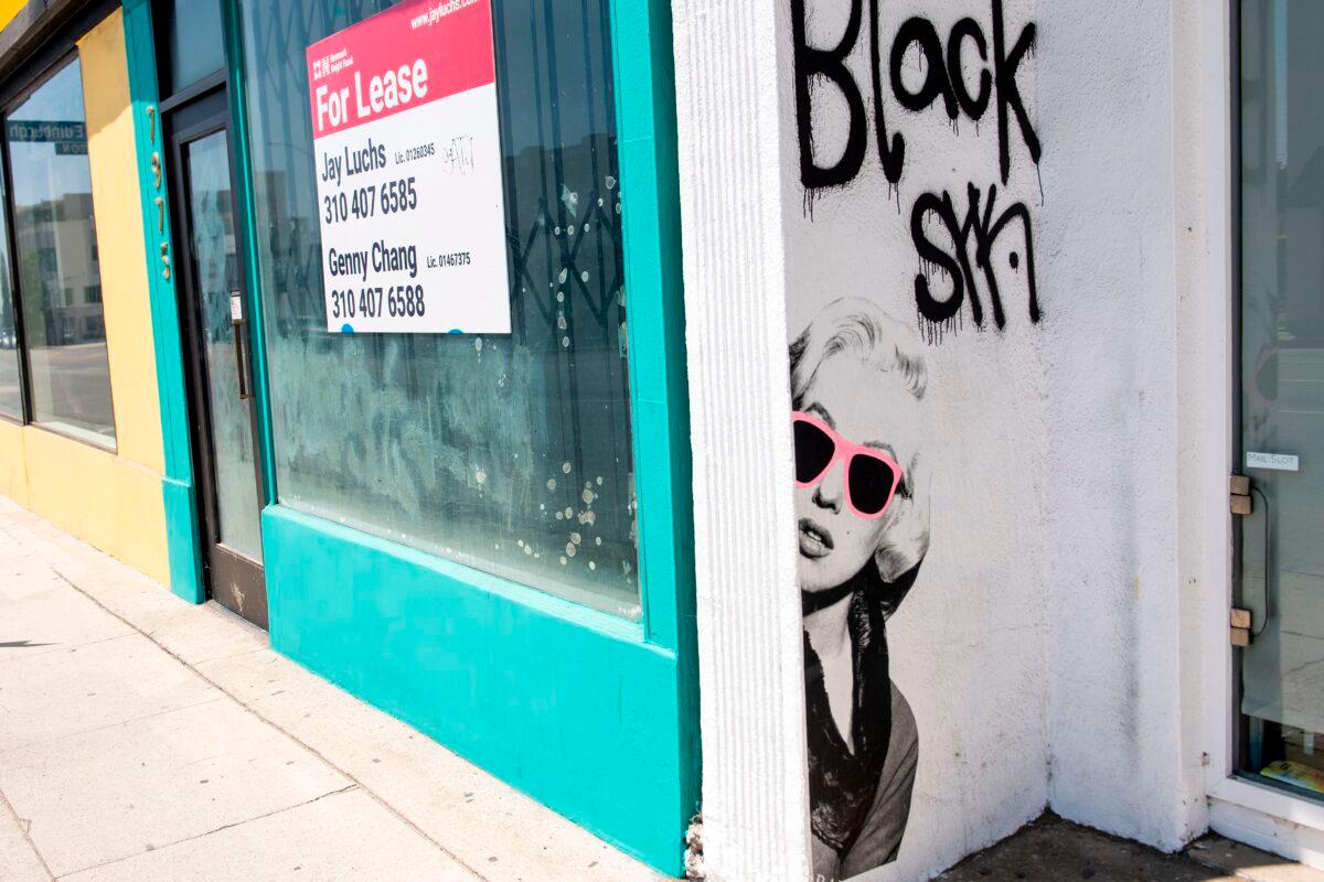 A For Lease sign on the window of a closed store on the famous shopping area of Melrose Avenue in Los Angeles on Aug. 3, 2020, amid the coronavirus pandemic. (Valerie Macon/AFP via Getty Images)