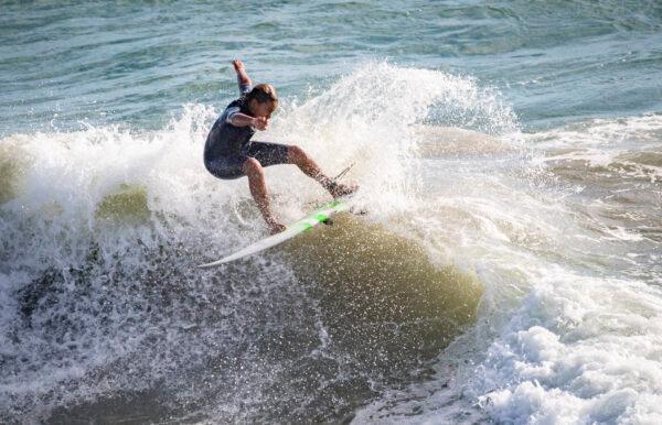 Surfers enjoy the waves of Huntington Beach, Calif., on Sept. 22, 2021. (John Fredricks/The Epoch Times)