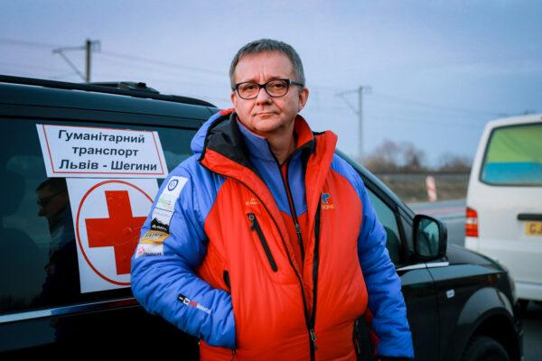 Adrian Briss, a Polish realtor, is traveling from Poland to pick up a vanload of refugees from Lviv, Ukraine, next to the Medyka border crossing in Poland, on March 12, 2022. (Charlotte Cuthbertson/The Epoch Times)