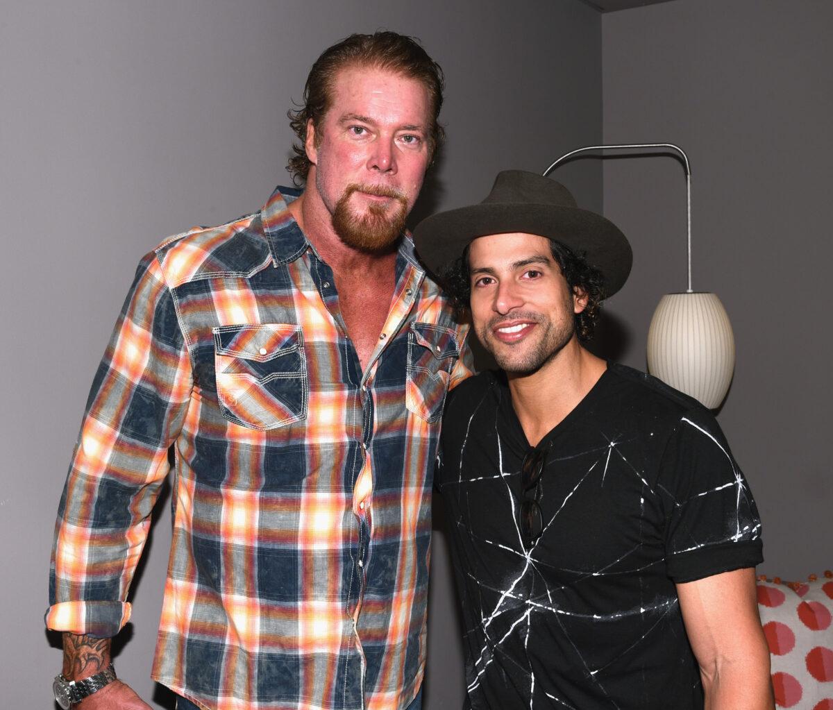 Wrestler Kevin Nash (L) and actor Adam Rodriguez pose for a photo during the Matt Bomer Spotlight Award Tribute at Trustees Theater on Day Two of the 17th Annual Savannah Film Festival presented by SCAD in Savannah, Georgia, on Oct. 26, 2014. (Andrew H. Walker/Getty Images for SCAD)