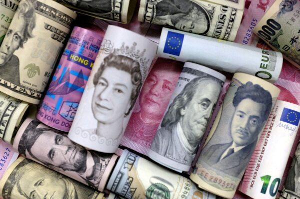Euro, Hong Kong dollar, U.S. dollar, Japanese yen, British pound, and Chinese 100 yuan banknotes are seen in this picture illustration, on Jan. 21, 2016. (Jason Lee/Illustration/Reuters)