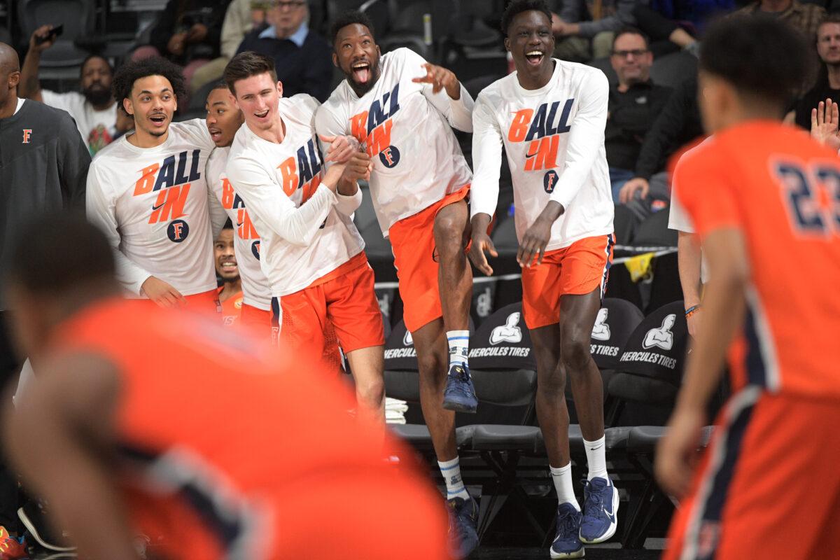 The Cal State Fullerton Titans bench celebrates during the championship game of the Big West Conference basketball tournament against Long Beach State in Henderson, Nev., on March 12, 2022. (Sam Morris/Getty Images)