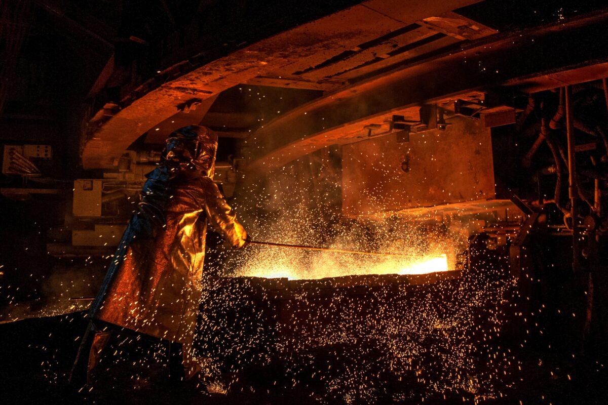 A worker manning a furnace during the nickel smelting process at Indonesian mining company PT Vale's smelting plant in Soroako, South Sulawesi, on March 30, 2019. (Bannu Mazandra/AFP via Getty Images)