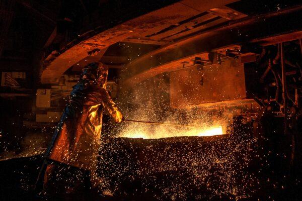 This March 2019 photo shows a worker manning a furnace during the nickel smelting process at Indonesian mining company PT Vale's smelting plant in Soroako, South Sulawesi. (BANNU MAZANDRA/AFP via Getty Images)