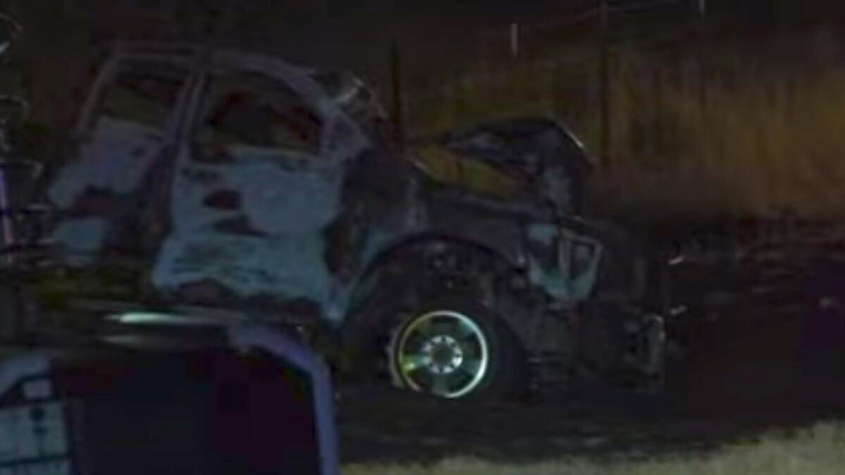 This still image from a video shows the wreckage of a Ford F-150 pickup truck that was involved in a fatal crash in Andrews County, Texas, on March 15, 2022. (Screenshot from video via AP)