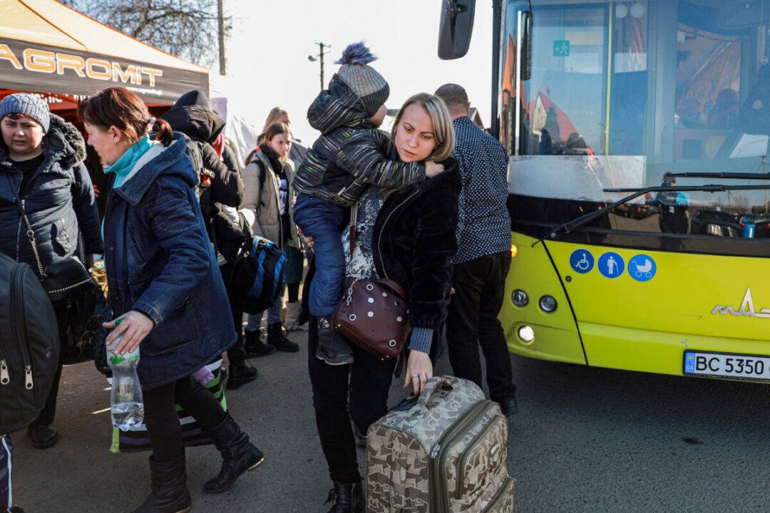 On Ukraine-Poland Border, Aid Floods in as Refugees Flee