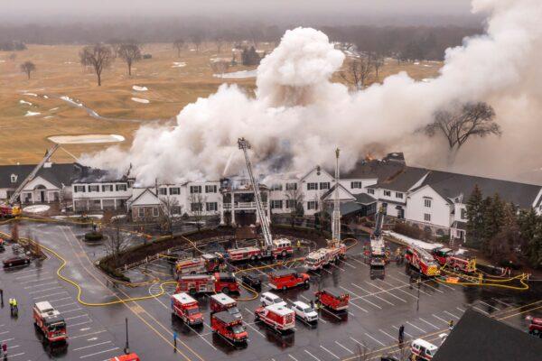 Firefighters battle a fire at the Oakland Hills Country Club, in Bloomfield Hills, Mich. on Feb. 17, 2022. (David Guralnick/Detroit News via AP)