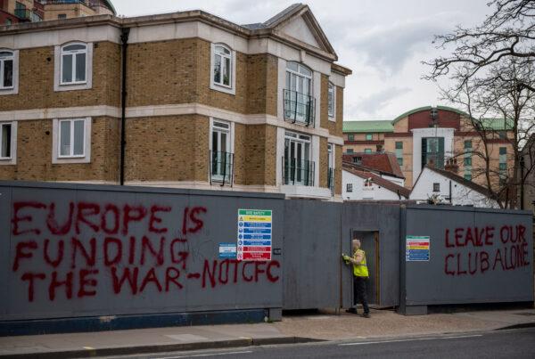 Graffiti on boarding at a construction site next to Chelsea Football Club at Stamford Bridge, in London, on March 11, 2022 (Chris J Ratcliffe/Getty Images)