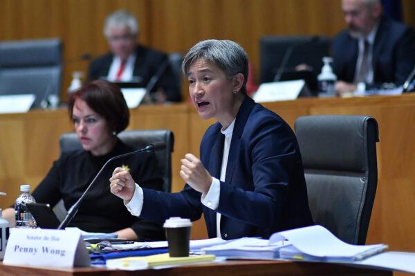 Sen. Penny Wong (R), beside Sen. Kimberley Kitching (L), reacts during the Foreign Affairs, Defence and Trade Legislation Budget Estimates 2021–22 at Parliament House in Canberra, Australia, on June 2, 2021. (Sam Mooy/Getty Images)