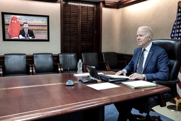 U.S. President Joe Biden holds virtual talks with Chinese leader Xi Jinping from the Situation Room at the White House in Washington, on March 18, 2022. (The White House via AP)