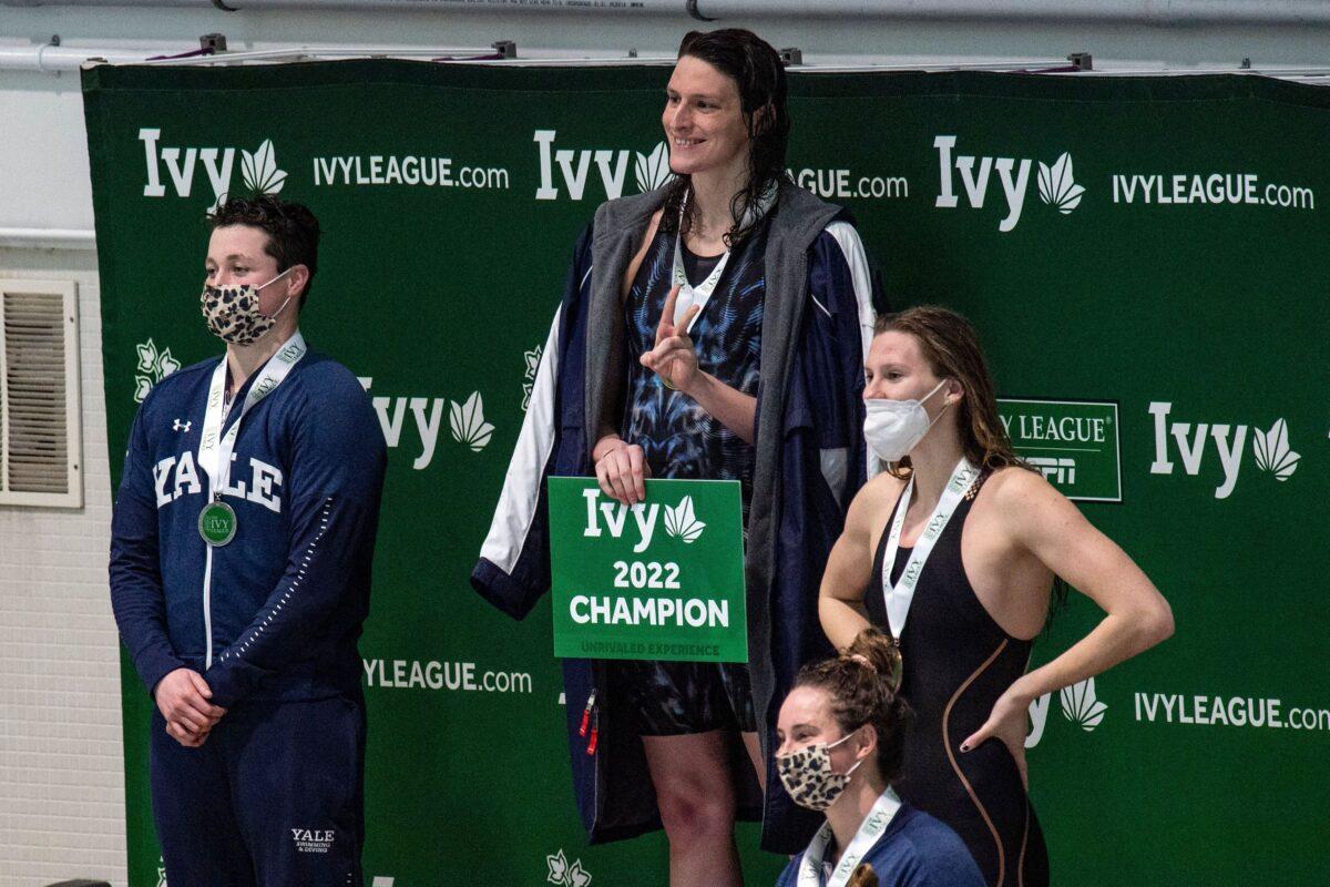  Transgender swimmer Lia Thomas (2nd L) of Penn University and transgender swimmer Iszac Henig (L) of Yale pose with their medals after placing first and second in the 100-yard freestyle swimming race at the 2022 Ivy League Women's Swimming & Diving Championships at Harvard University in Cambridge, Mass., on Feb. 19, 2022. (Joseph Prezioso/Getty Images)