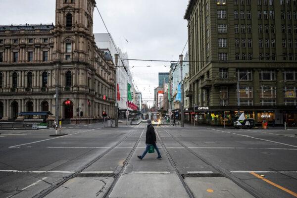 A person crosses Bourke Street in Melbourne, Australia, on July 20, 2021. (Daniel Pockett/Getty Images)