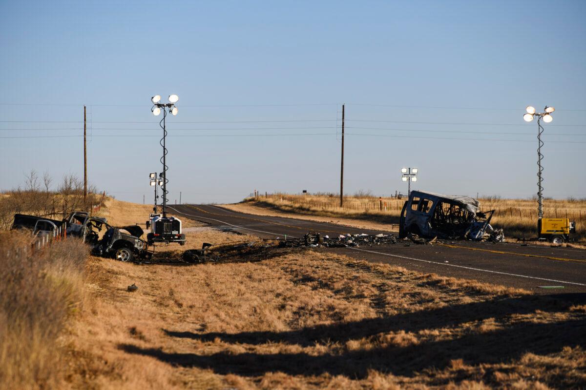 Texas Department of Public Safety Troopers look over the scene of a fatal car wreck, half of a mile north of State Highway 115 on Farm-to-Market Road 1788 in Andrews County, Texas, on March 16, 2022. (Eli Hartman/Odessa American via AP)