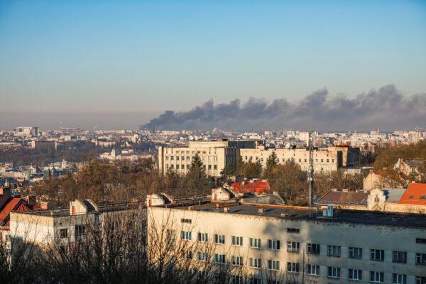Smoke billows out from the Lviv Airport after an early morning air strike hit an aircraft repair plant, in Lviv, Ukraine, on March 18, 2022. (Charlotte Cuthbertson/The Epoch Times)