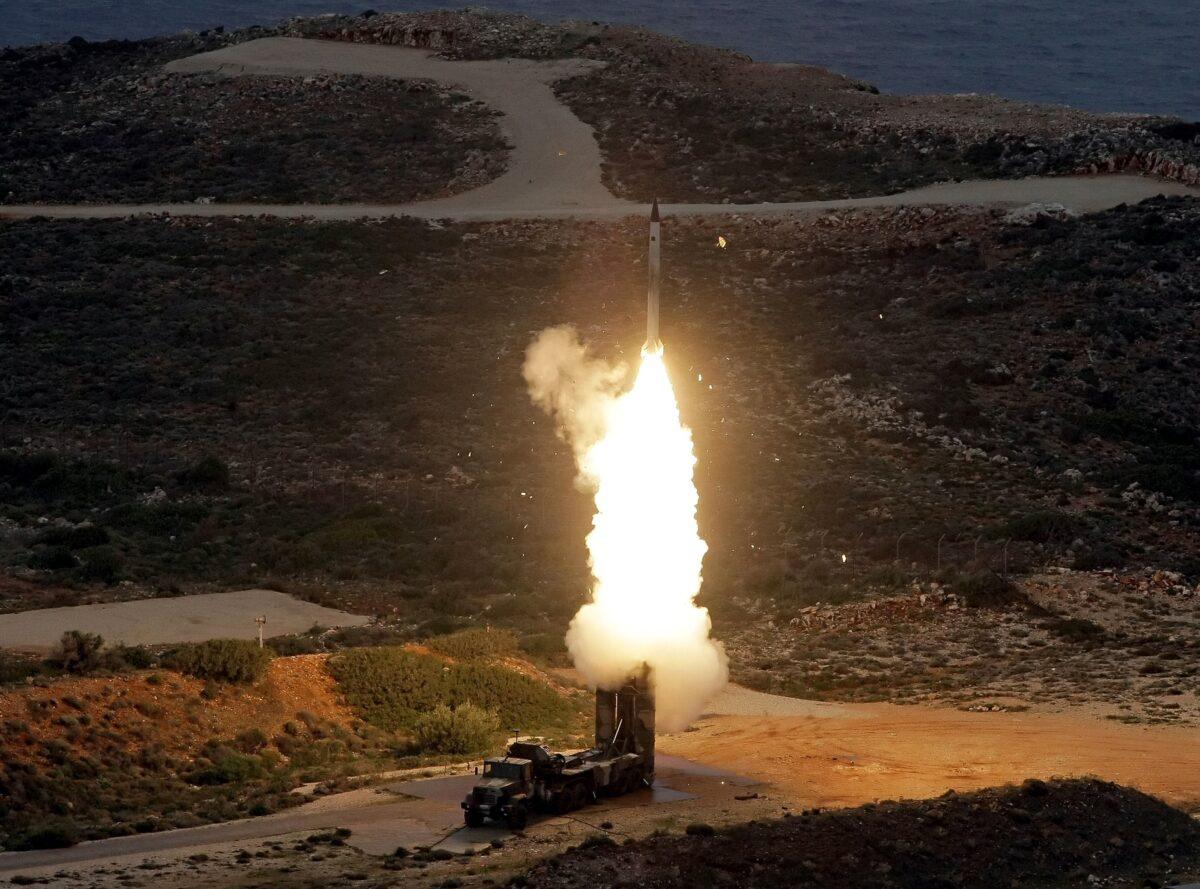 An S-300 air defense system launches during military exercises near Chania, on the island of Crete, Greece, on Dec. 13, 2013. (Costas Metaxakis/AFP via Getty Images)