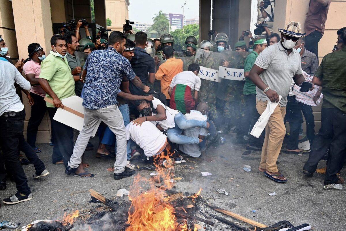 Opposition activists protest against rising living costs at the entrance of the Sri Lankan president's office in Colombo, Sri Lanka, on March 15, 2022. (Ishara S. Kodikara/AFP via Getty Images)