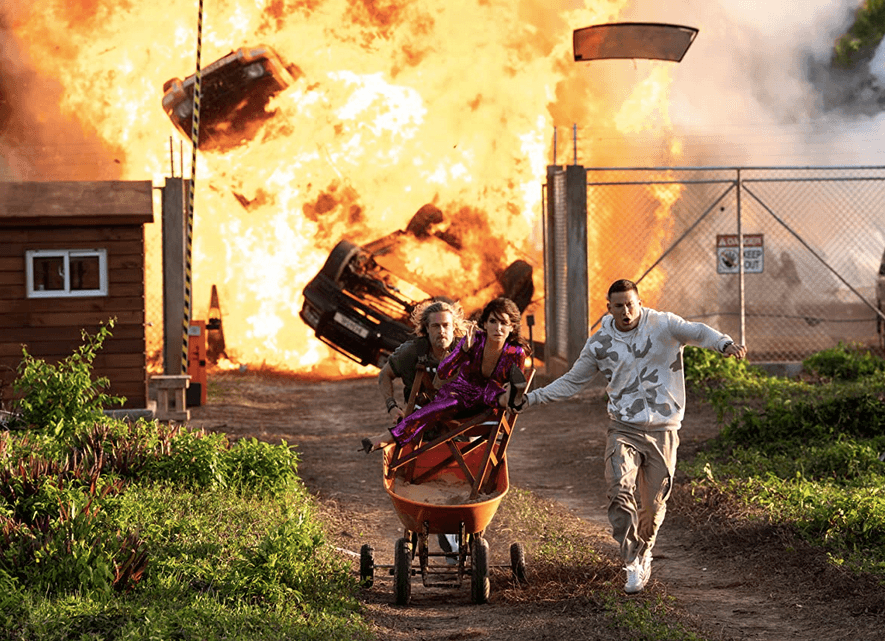 (L–R) Jack (Brad Pitt), Loretta (Sandra Bullock), and Alan (Channing Tatum) flee an explosion, in "The Lost City." (Paramount Pictures)