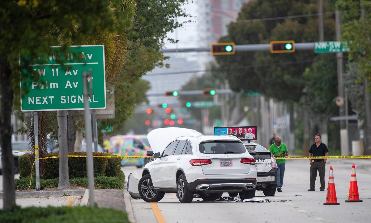 Law enforcement personnel investigate at the scene of shooting on a Broward County Transit bus in Fort Lauderdale, Fla., On March 17, 2022. (Michael Laughlin/South Florida Sun-Sentinel via AP)