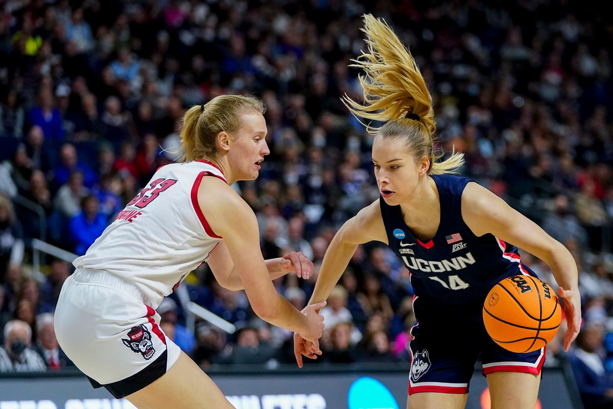 Connecticut forward Dorka Juhasz (14) drives against NC State center Elissa Cunane (33) during the second quarter of the East Regional final college basketball game of the NCAA women's tournament in Bridgeport, Conn., on March 28, 2022. (Frank Franklin II/AP Photo)