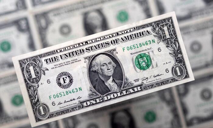 Dollar Holds Fast Ahead of Fed Decision, Sterling Falls on Cool UK Inflation
