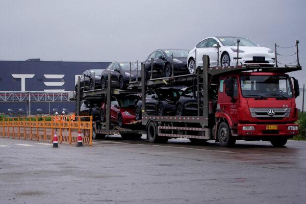 A truck transports new Tesla cars at its factory in Shanghai, China May 13, 2021. (Reuters/Aly Song)