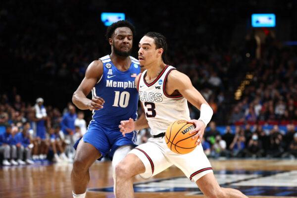 Andrew Nembhard #3 of the Gonzaga Bulldogs dribbles the ball passed Alex Lomax #10 of the Memphis Tigers during the second half in the second round of the 2022 NCAA Men's Basketball Tournament at Moda Center, in Portland, Oregon, on March 19, 2022. (Ezra Shaw/Getty Images)