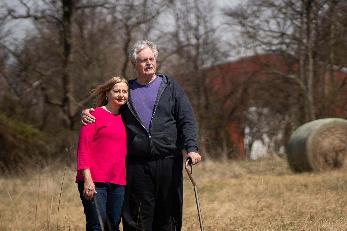 Thomas and Sharon Caldwell on their farm, now empty after they sold their animals and equipment to pay legal bills, in Berryville, Va., on March 19, 2022. (Samira Bouaou/The Epoch Times)