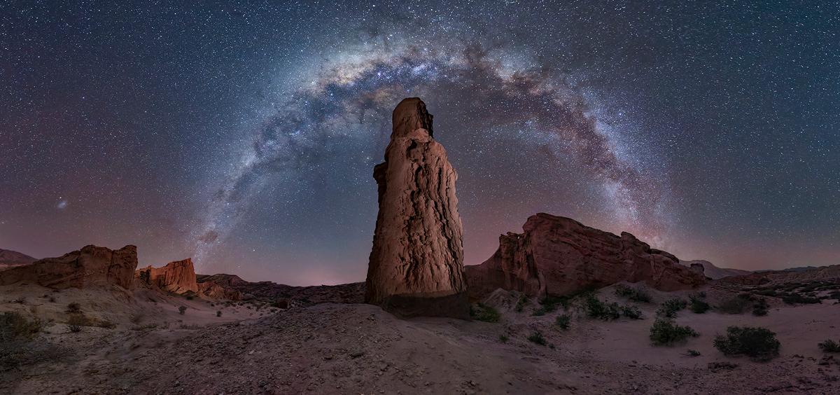 "El Vigia" by Gonzalo Javier Santile, Argentina; “A strong, hot wind known as Los Colorados was blowing when I took this photograph in Cafayete, Argentina, so I buried my tripod the best I could, using rocks to stabilize it. The image consists of 20 shots – six of the sky and six of the foreground shot at 15mm with a shutter speed of 20 seconds. I love the combination of the Milky Way and these unique mountain rocks.” (© Gonzalo Javier Santile, Argentina, 2nd Place, National Awards, Creative, 2022 Sony World Photography Awards)
