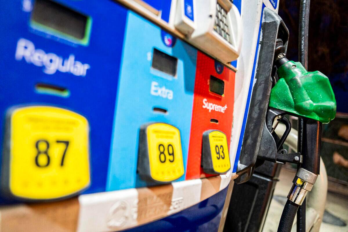 A gasoline pump sits in a holder at an Exxon gas station in Washington on March 13, 2022. (Stefani Reynolds/AFP via Getty Images)