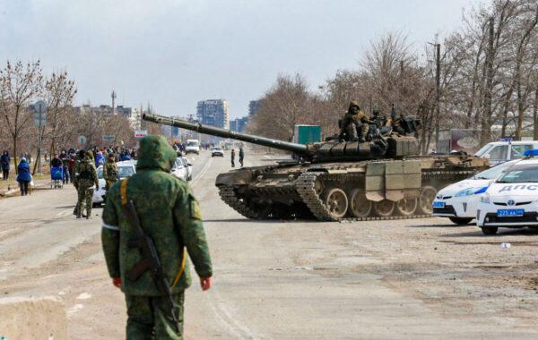 Servicemembers of pro-Russian troops atop a tank during the Ukraine–Russia conflict on the outskirts of the besieged southern port city of Mariupol, Ukraine, on March 20, 2022. (Alexander Ermochenko/Reuters)