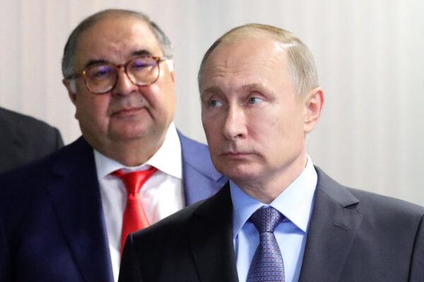 Russian President Vladimir Putin (R) and founder of USM Holdings Alisher Usmanov (L) look on at the control center at Lebedinsky Mining and Processing Combine in the Belgorod Region, Russia, on July 14, 2017. (Mikhail Klimentyev/Sputnik/AFP via Getty Images)